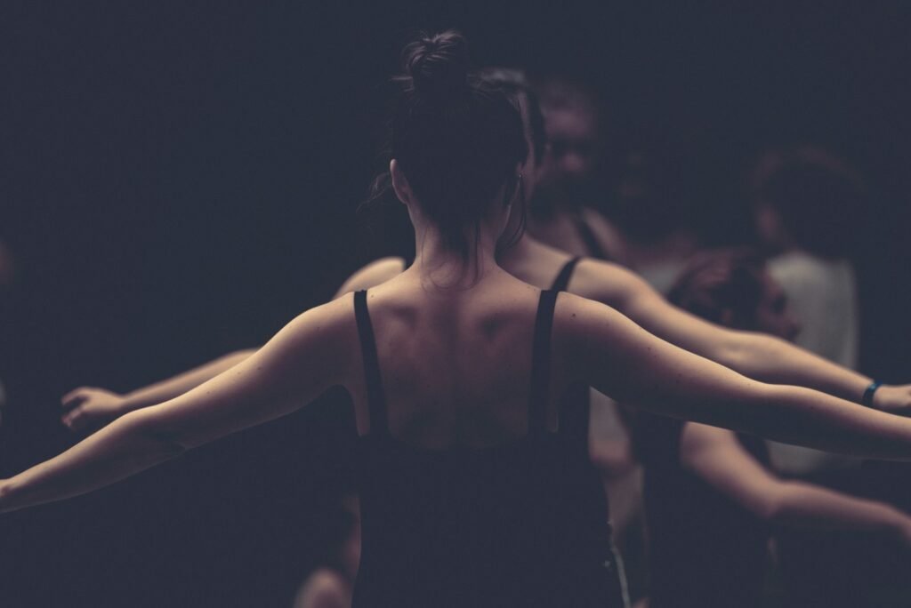 woman in black spaghetti strap top